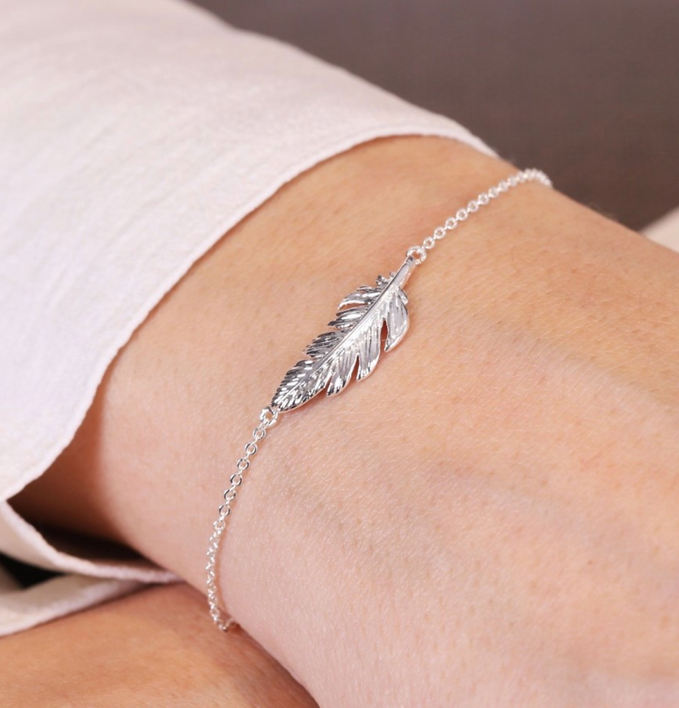 Thumbnail: Delicate chain bracelet with feather charm available in both gold or silver