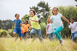 children running and smiling