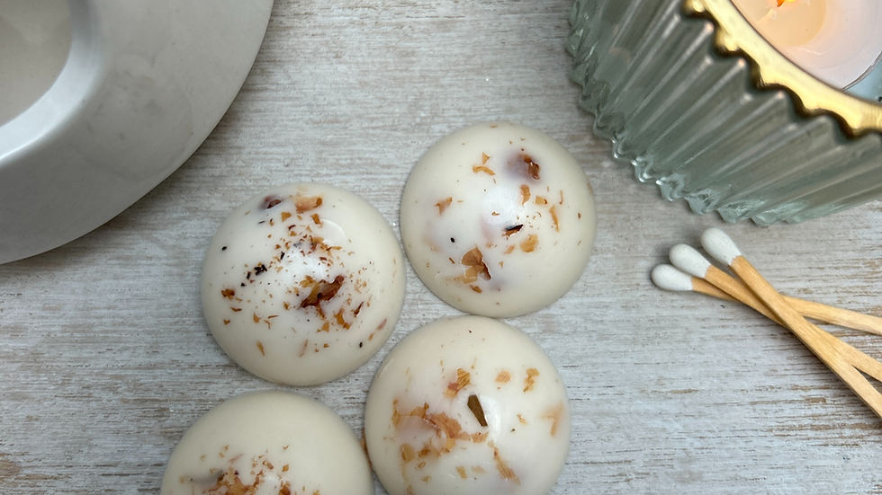 Close-up view of a ceramic wax melt warmer with botanical wax melts melting inside