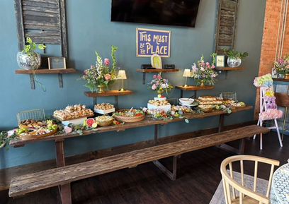 Buffet and catered food setup for a celebration at Social 1832 event space.