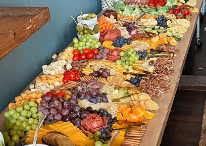 Large grazing table and charcuterie spread prepared for guests at Social 1832 event venue.