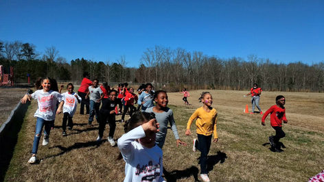 Woodland Elementary students participating in a Color Run fundraiser.