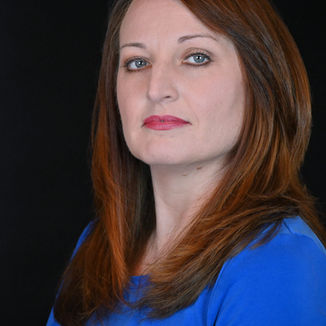 red headed woman looking serious