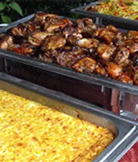 Buffet trays with grilled chicken and rice