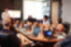a photo of a employee training and development meeting