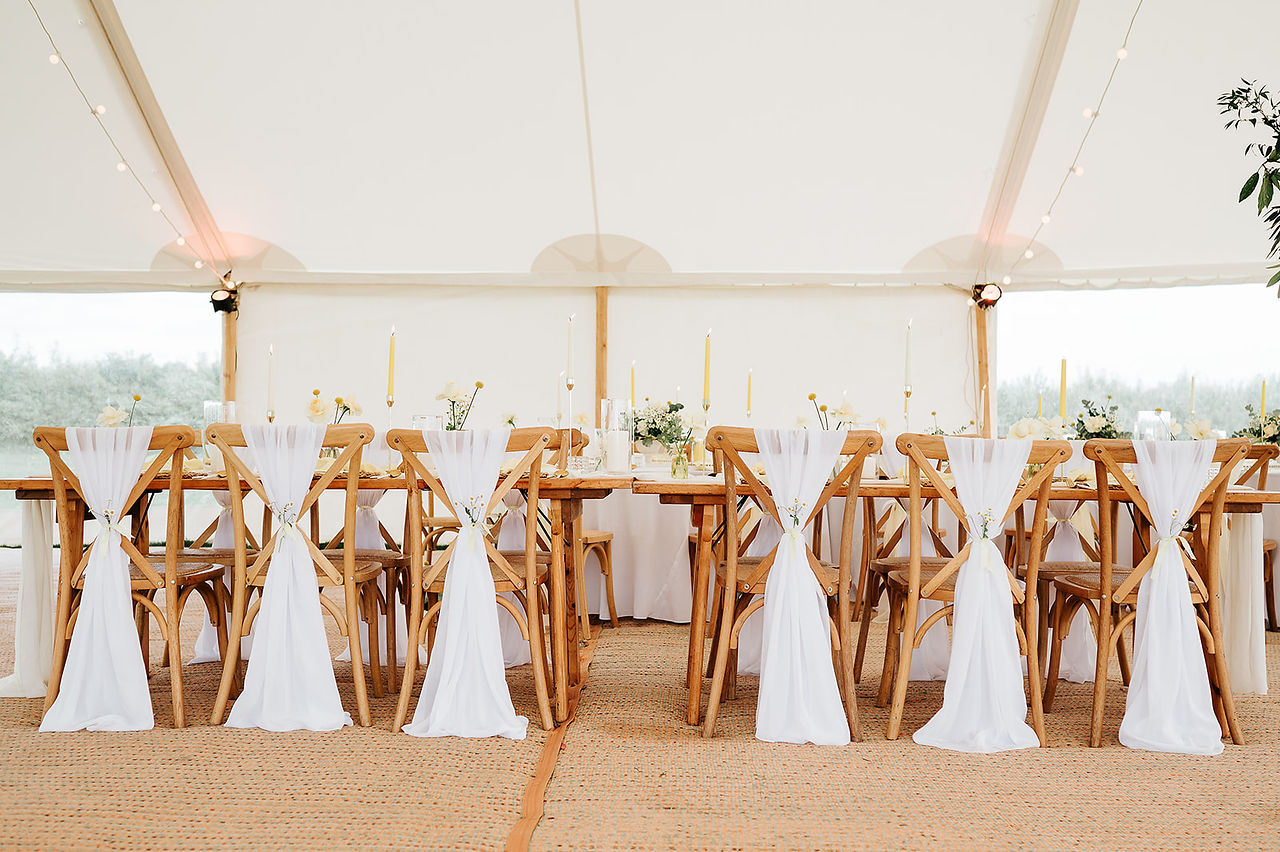 white chiffon chair drapes with greenery