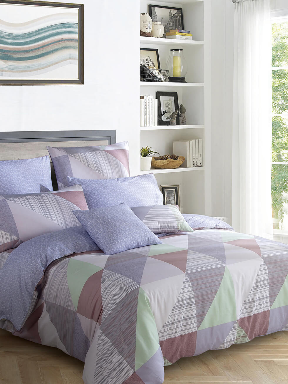 purple and geometric bed with a wavy picture frame on the wall
