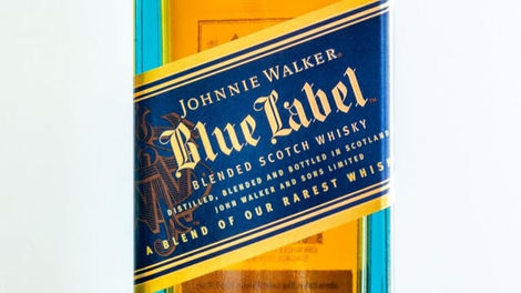 Johnnie Walker Blue Label bottle showcasing its iconic blue and gold label, highlighting its status as a blend of the brand's rarest whiskies.