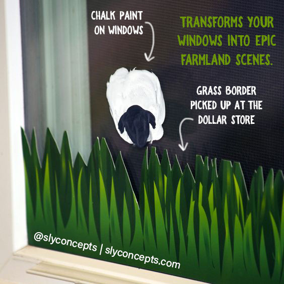 A window decorated with a grass paper border along the bottom to create a simple Shaun the Sheep farm scene.