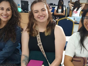 Zuleima Chavez smiling alongside two young women while serving in Thailand, representing faith, friendship, and compassionate outreach through missions.