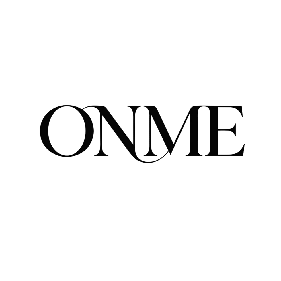 Graphic design logo featuring the text 'ONME' in a subtle, high-contrast black aesthetic. The minimalist typography is deeply embedded into the dark background, conveying a sleek, modern, or fashion-forward mood.