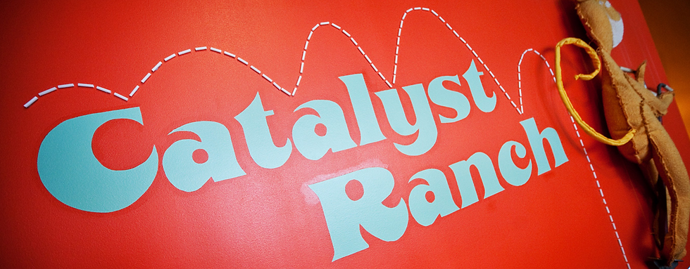 Catalyst Ranch logo. Popping colors and creative energy of the Catalyst Ranch logo on the interior of their events space.