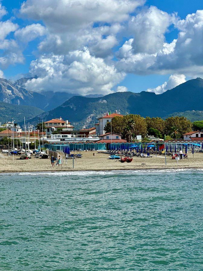 Beautiful view of the beach in Forte dei Marmi with the mountains in the background