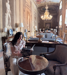 Travel advisor reading a magazine in a beautiful palace hotel in Florence.