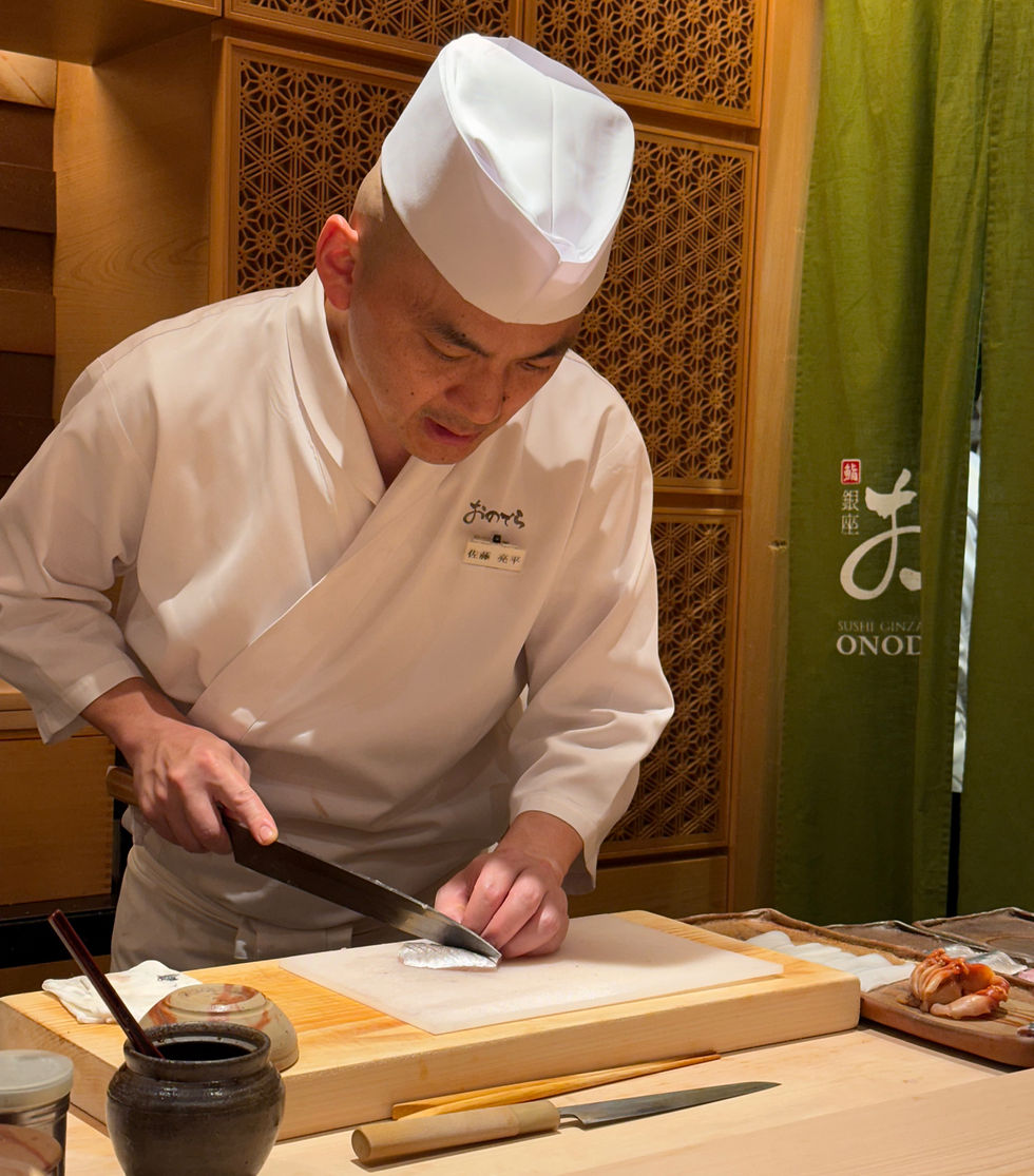 Skilled chef preparing omakase dinner in Tokyo, Japan