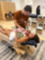 A small baby gets a gentle pediatric adjustment from a pediatric chiropractor