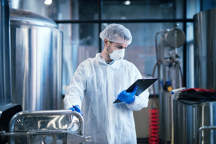 industrial-worker-white-protective-clothes-holding-checklist-reading-results.jpg