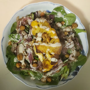 Cauliflower Steak with Cumin Roasted Chickpeas, Caramelized Red Onion and Tahini Drizzle