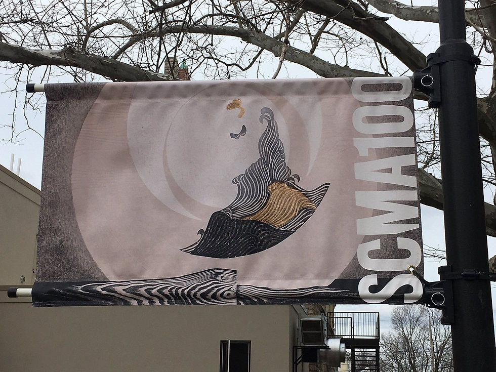 A banner on campus celebrating the Smith College Museum of Art's centennial, featuring one of the Reika IIwami woodblocks donated to Smith by The Tolman Collection