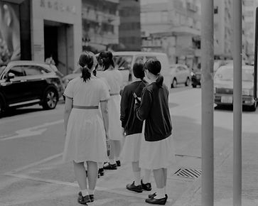 a black and white photo of a group of girls walking down the street_edited_edited.jpg