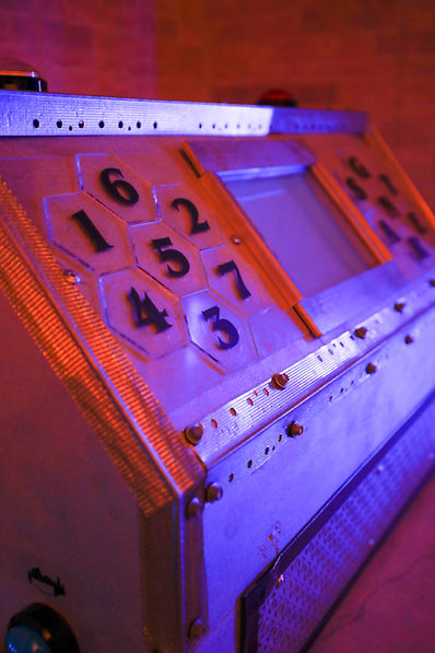 Hands-on puzzle challenge with numbered tiles in an immersive escape room experience near Holyoke Massachusetts at REACT Premium Escape Rooms