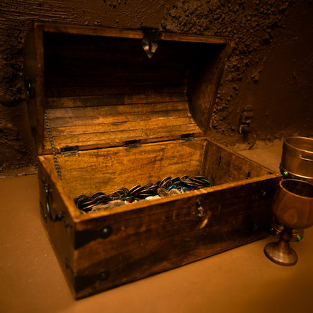 Treasure chest open with gold inside