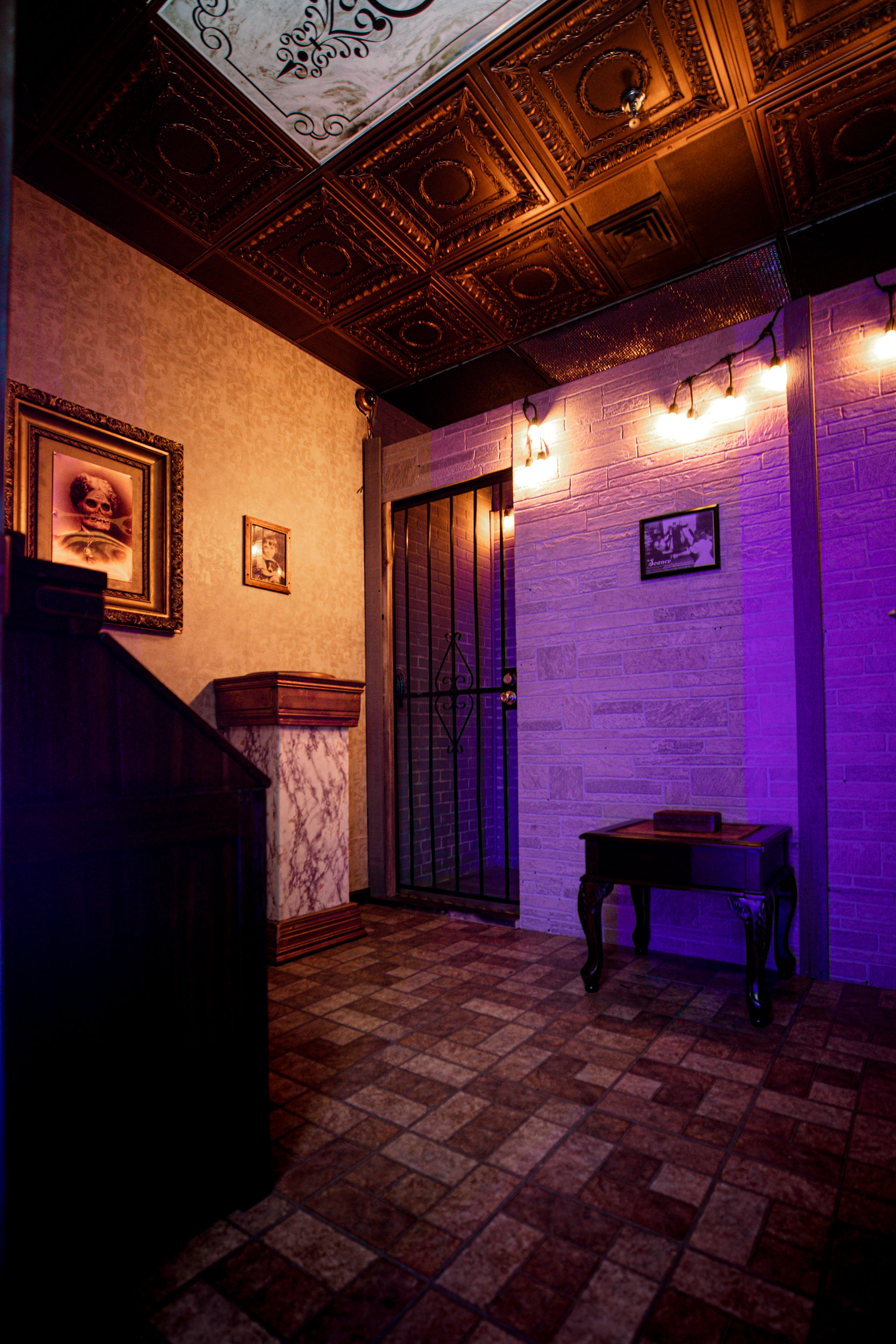 Haunted Mansion Set featuring dimly lit room and locked metal door in back corner.