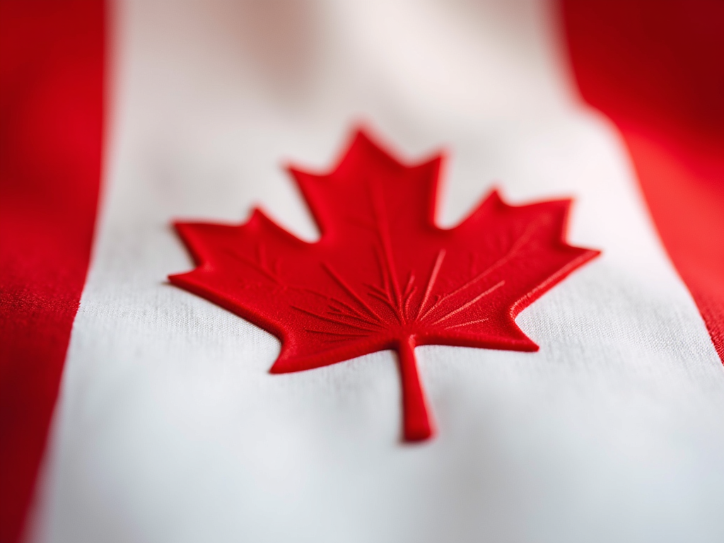 A vibrant red maple leaf artistic rendering honoring the Canadian spirit.