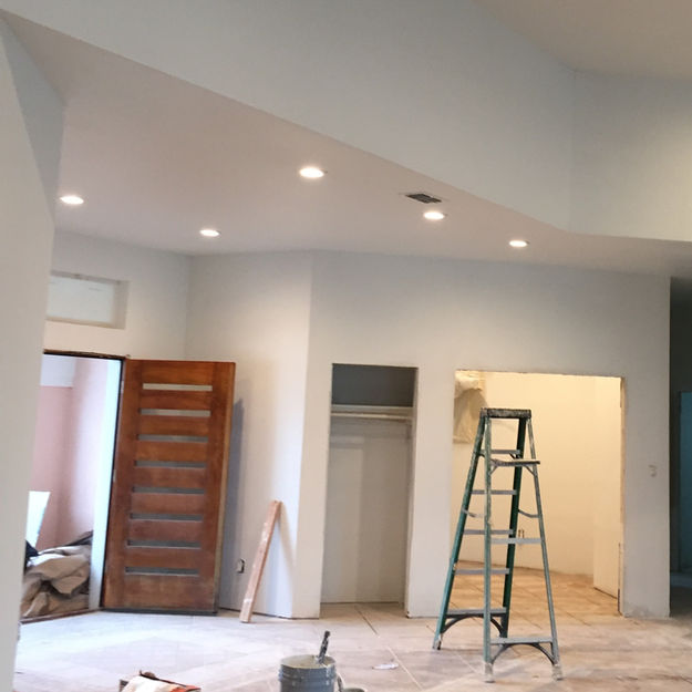 Interior entrance to home under construction with fresh white paint.