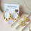 Thumbnail: GILDED EARRINGS-TRIO BEADED HOOPS