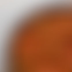 Bowl of lentil Bolognese topped with fresh basil and herbs.