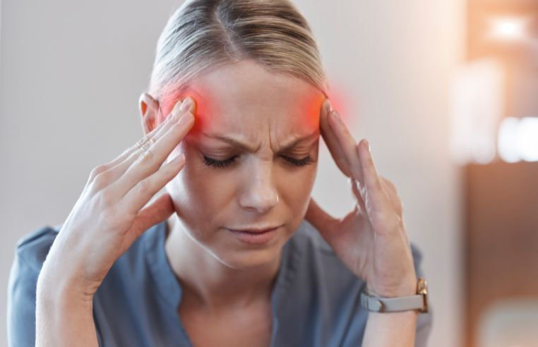 Woman experiencing migraine linked to hormonal changes before menstruation
