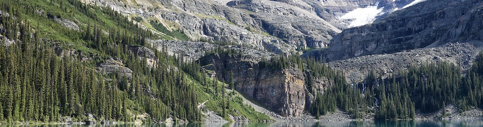 clear lake in front of mountains