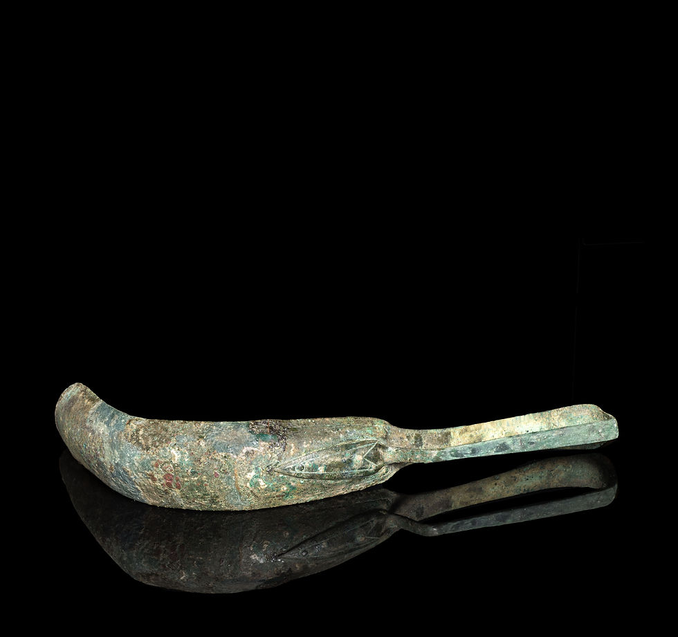 Thumbnail: Underside view of Ancient Greek bronze strigil with incised line decoration