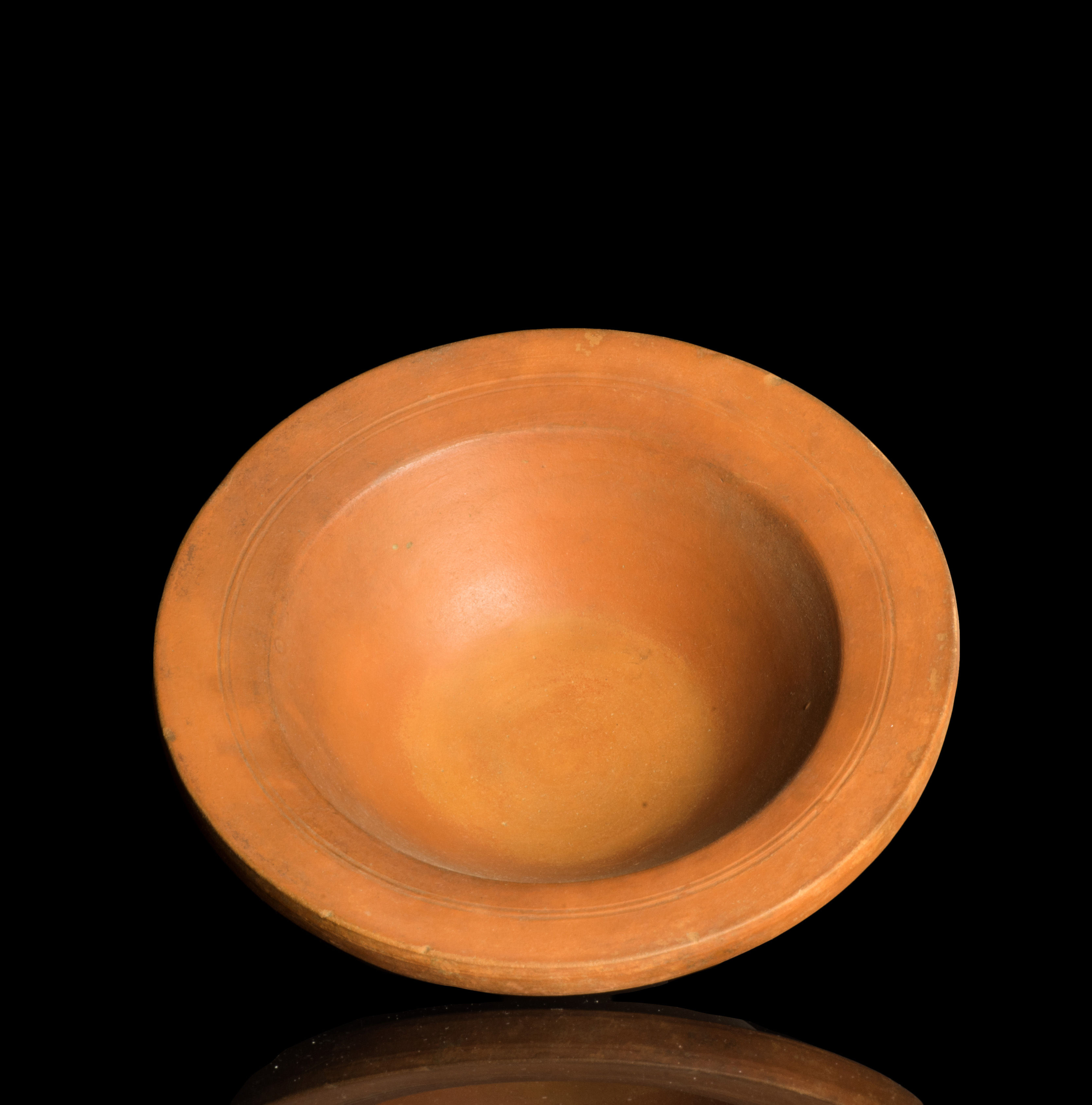 Ancient Roman African red slip ware dish with broad rim