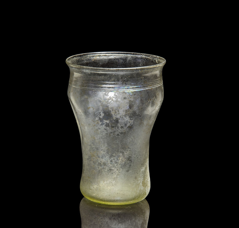 Thumbnail: Back view of Roman pale green glass beaker with indented sides