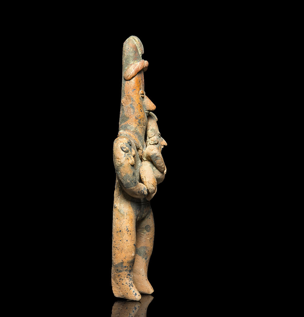 Side view of Pre-Columbian Mexico Colima Tuxcacuesco-Ortices type terracotta figure holding a child