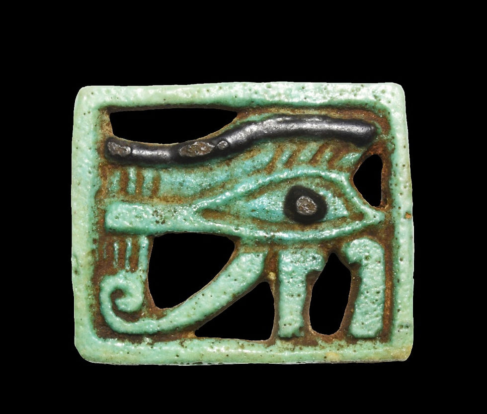 Pale green faience amulet of Wedjat or the Eye of Horus