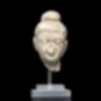 Ancient Gandhara fragmentary stucco head of Buddha with ushnisa