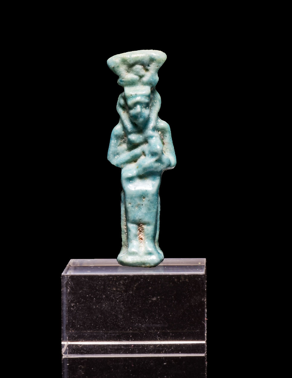 Front view of Ancient Egyptian faience amulet of Isis-Hathor nursing the baby Horus on a stand