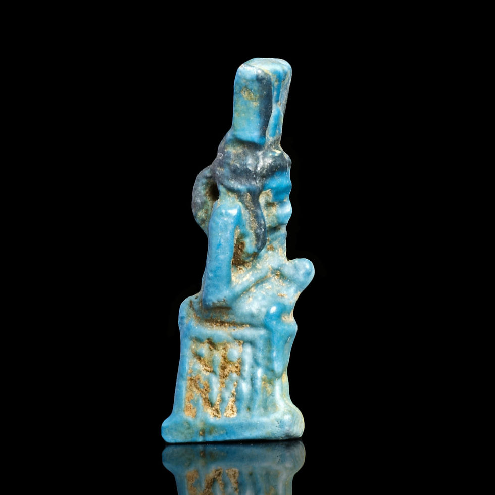 Right side view of Ancient Egyptian two-tone faience amulet of Isis nursing baby Horus