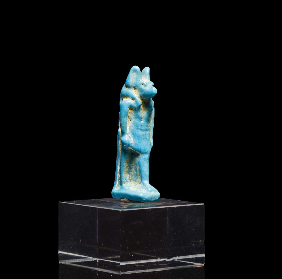 Ancient Egyptian amulet of god Anubis on a stand