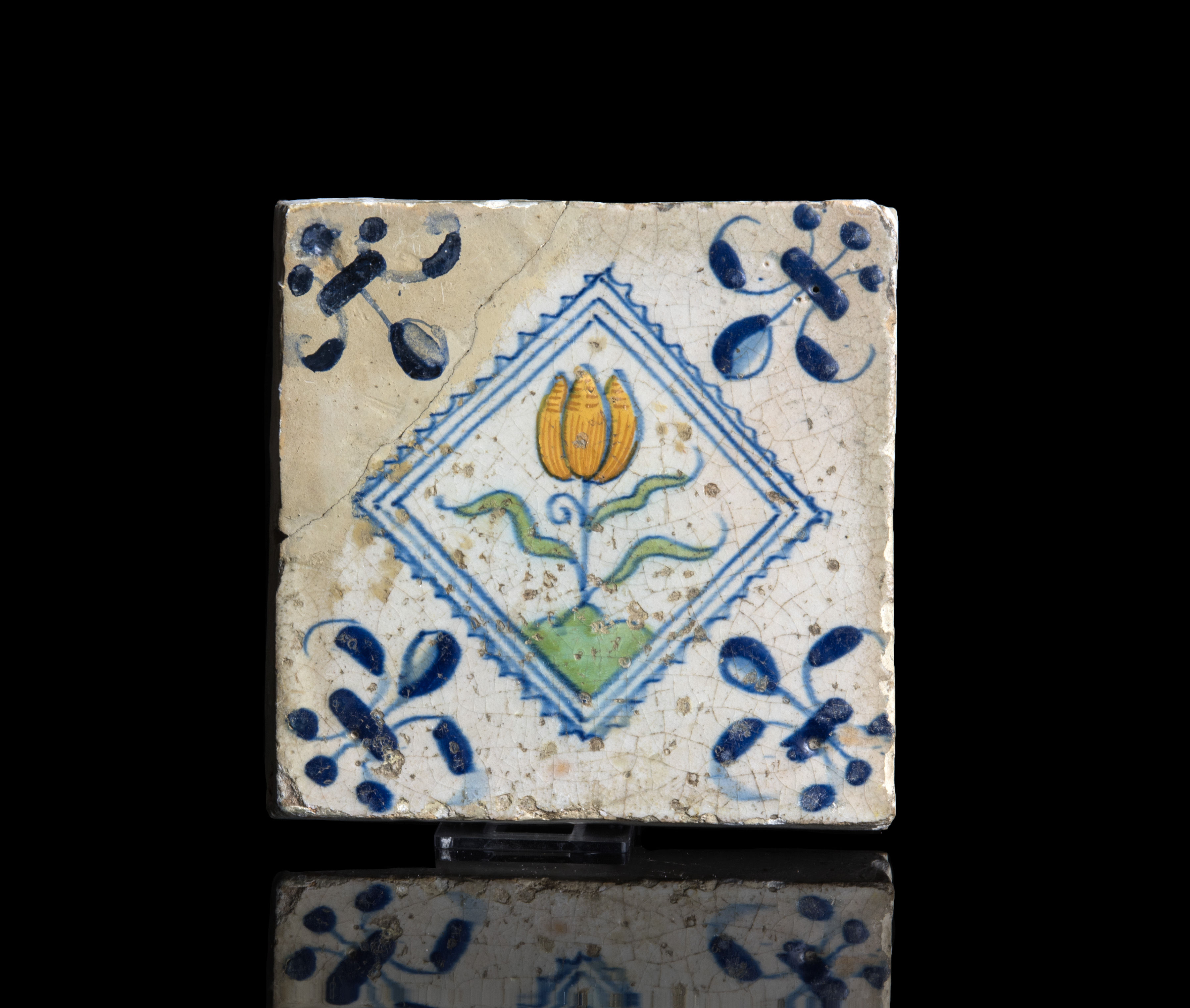 Early Delft polychrome ceramic tile with tulip from tulip mania time