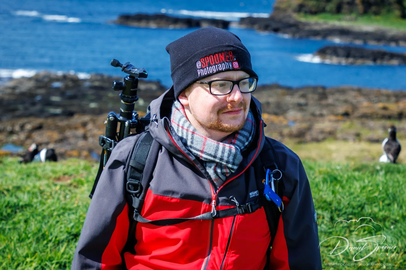 Spooner Photography on Lunga, tripod on back, Sunny day