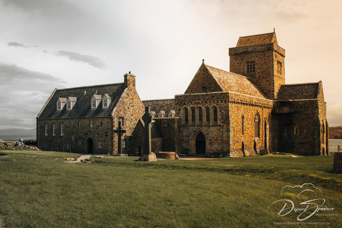 Historic stone cross and gravestone at Iona Abbey.
