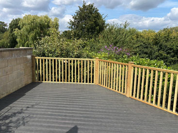 patio area with wooden fence