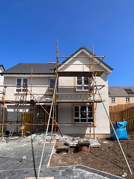 Roughcasting to exterior of property