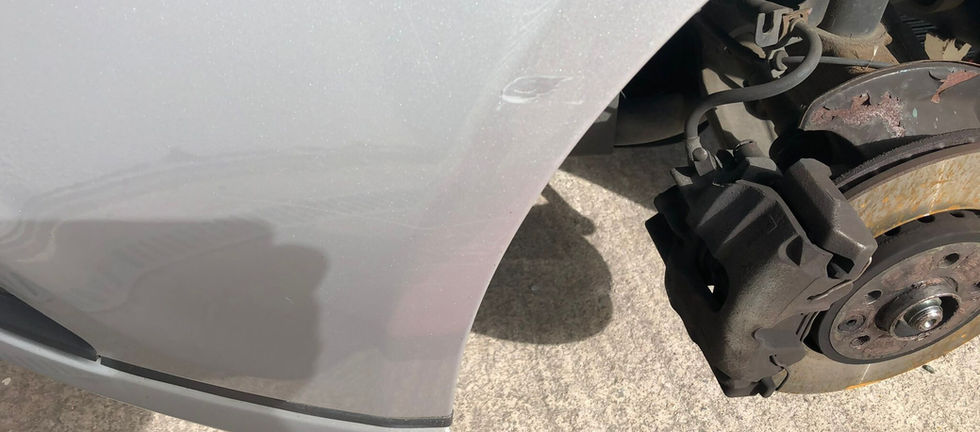 Silver front bumper damage repaired