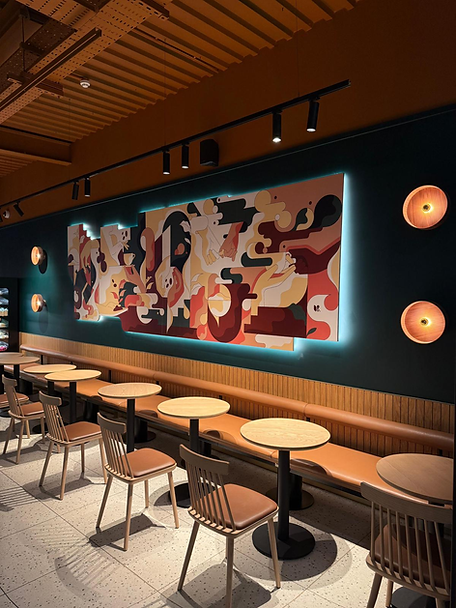 Professional interior lighting and vibrant wall art in restaurant.