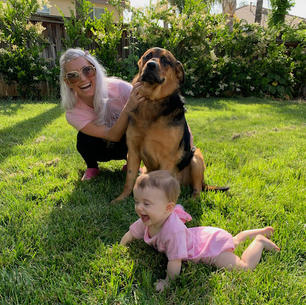 Playing with the baby and the dog.